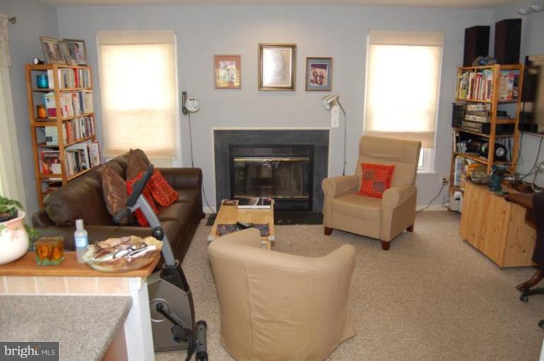 13114 Broadmore Road Silver Spring, MD 20904 - Photo 5 of 22 a living room with furniture and a fireplace