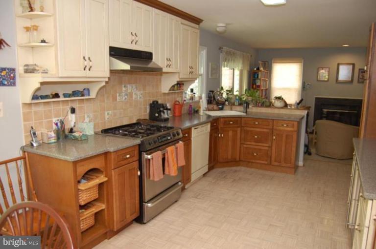 13114 Broadmore Road Silver Spring, MD 20904 - Photo 9 of 22 a kitchen with stainless steel appliances granite countertop a stove a sink and a refrigerator