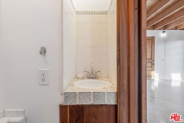 a bathroom with a sink and a mirror
