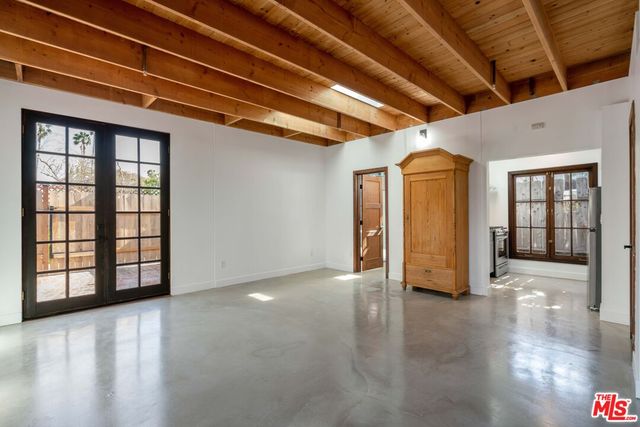 a view of an empty room with windows