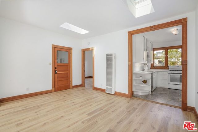 wooden floor in an empty room and a window