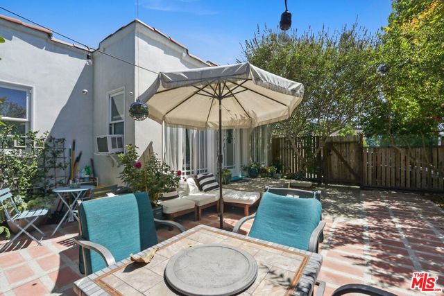 a patio with a patio table and chairs
