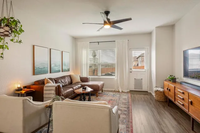 a kitchen with kitchen island granite countertop a sink cabinets and stainless steel appliances
