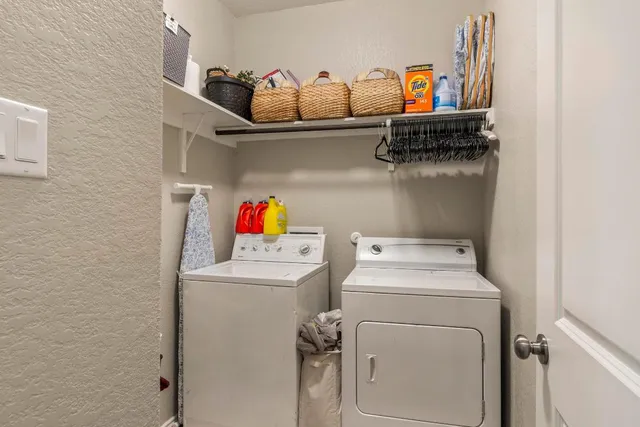 a living room with furniture ceiling fan and a window