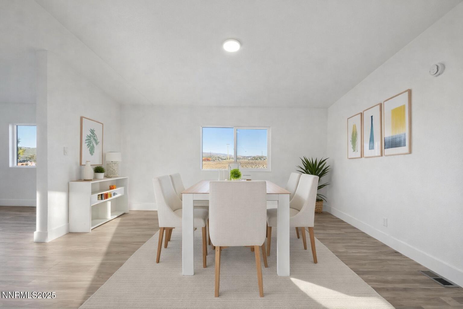 230 Medgar Avenue Reno, NV 89506 - Photo 11 of 43 a view of a dining room with furniture and wooden floor