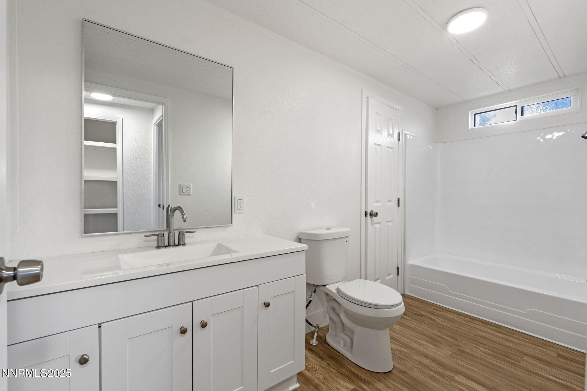 230 Medgar Avenue Reno, NV 89506 - Photo 18 of 43 a bathroom with a sink a toilet and shower