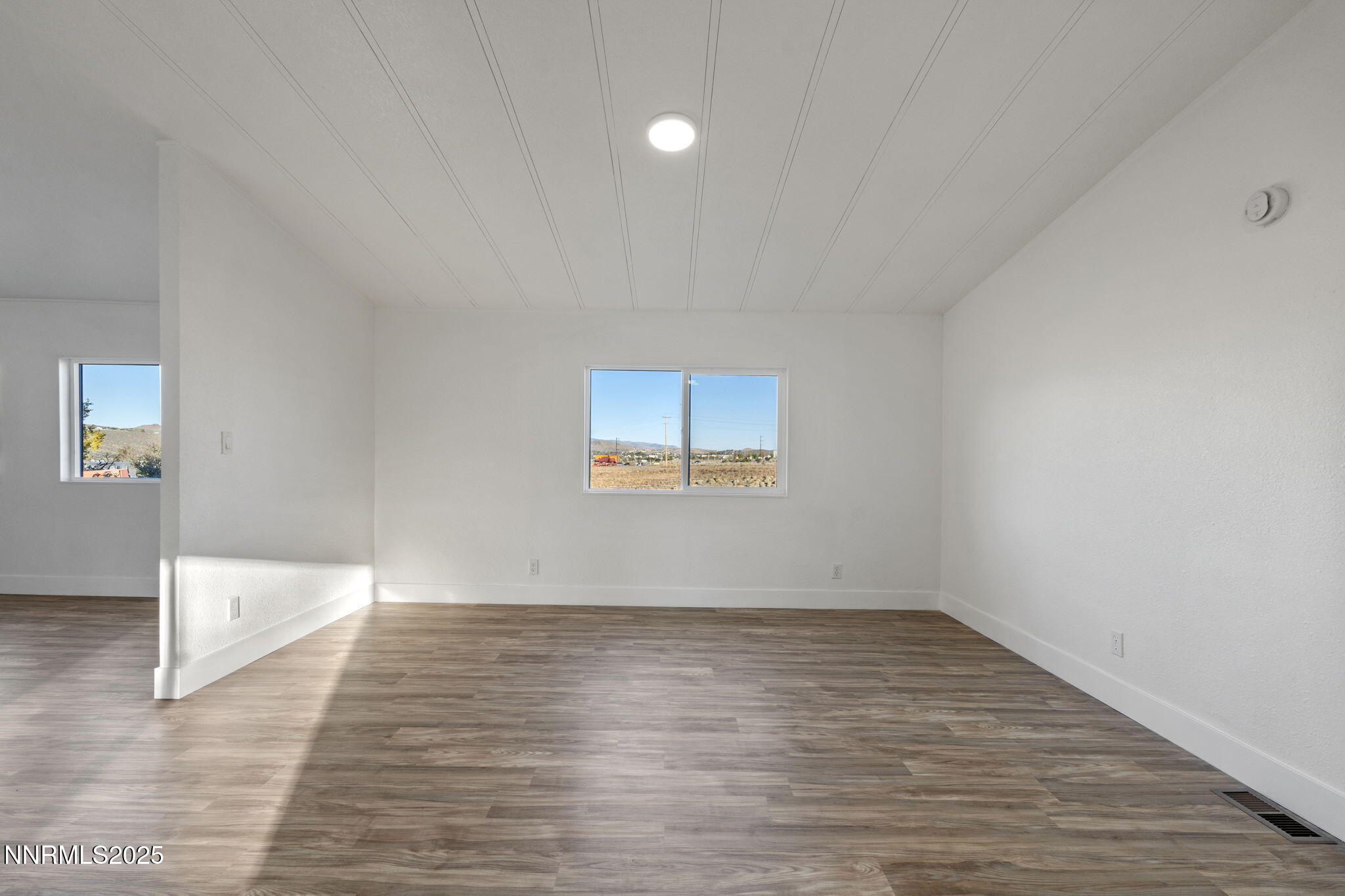 230 Medgar Avenue Reno, NV 89506 - Photo 10 of 43 a view of empty room with wooden floor