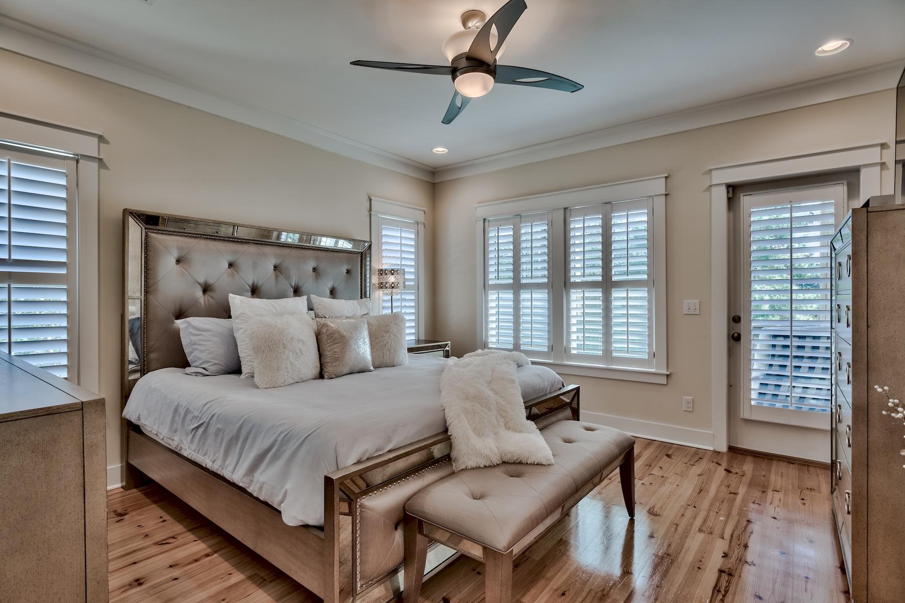25 South Summit Drive Santa Rosa Beach, FL 32459 - Photo 24 of 46 a bedroom with a bed and wooden floor