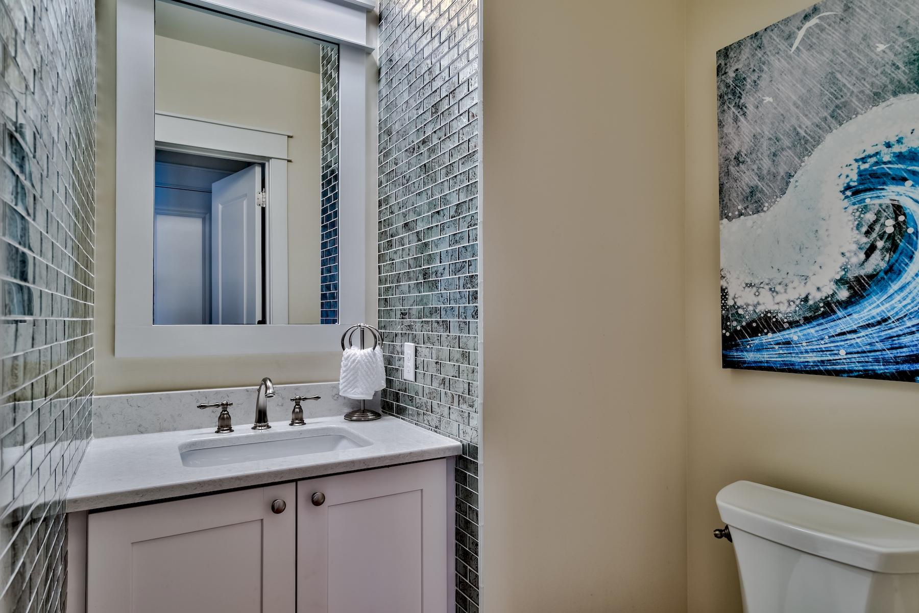 25 South Summit Drive Santa Rosa Beach, FL 32459 - Photo 28 of 46 a bathroom with a granite countertop sink and a toilet