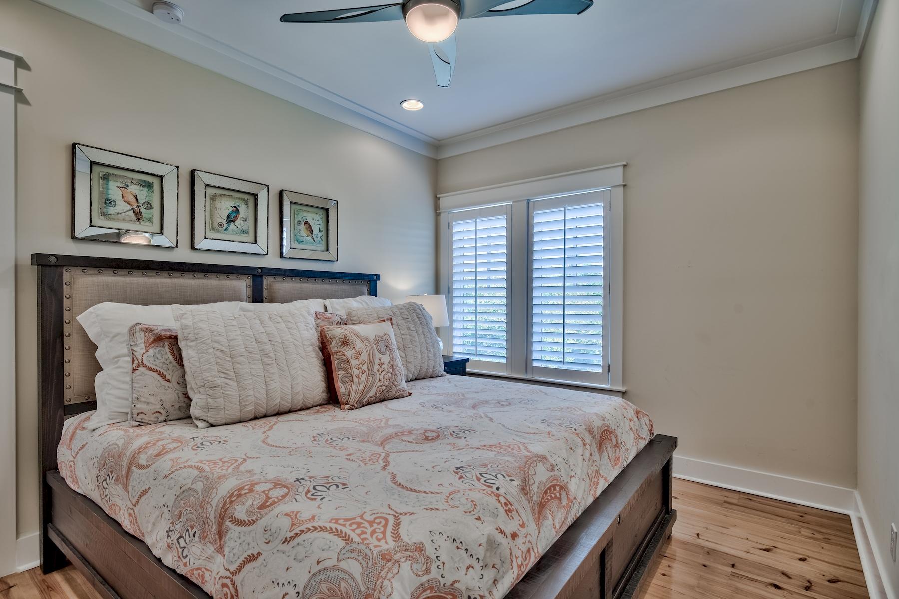 25 South Summit Drive Santa Rosa Beach, FL 32459 - Photo 29 of 46 a large bed sitting in a bedroom next to a window