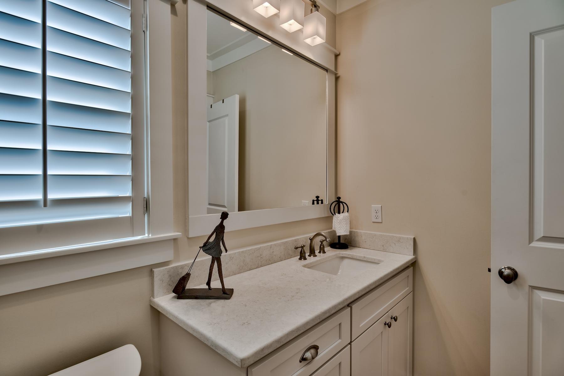 25 South Summit Drive Santa Rosa Beach, FL 32459 - Photo 31 of 46 a bathroom with a sink and a mirror