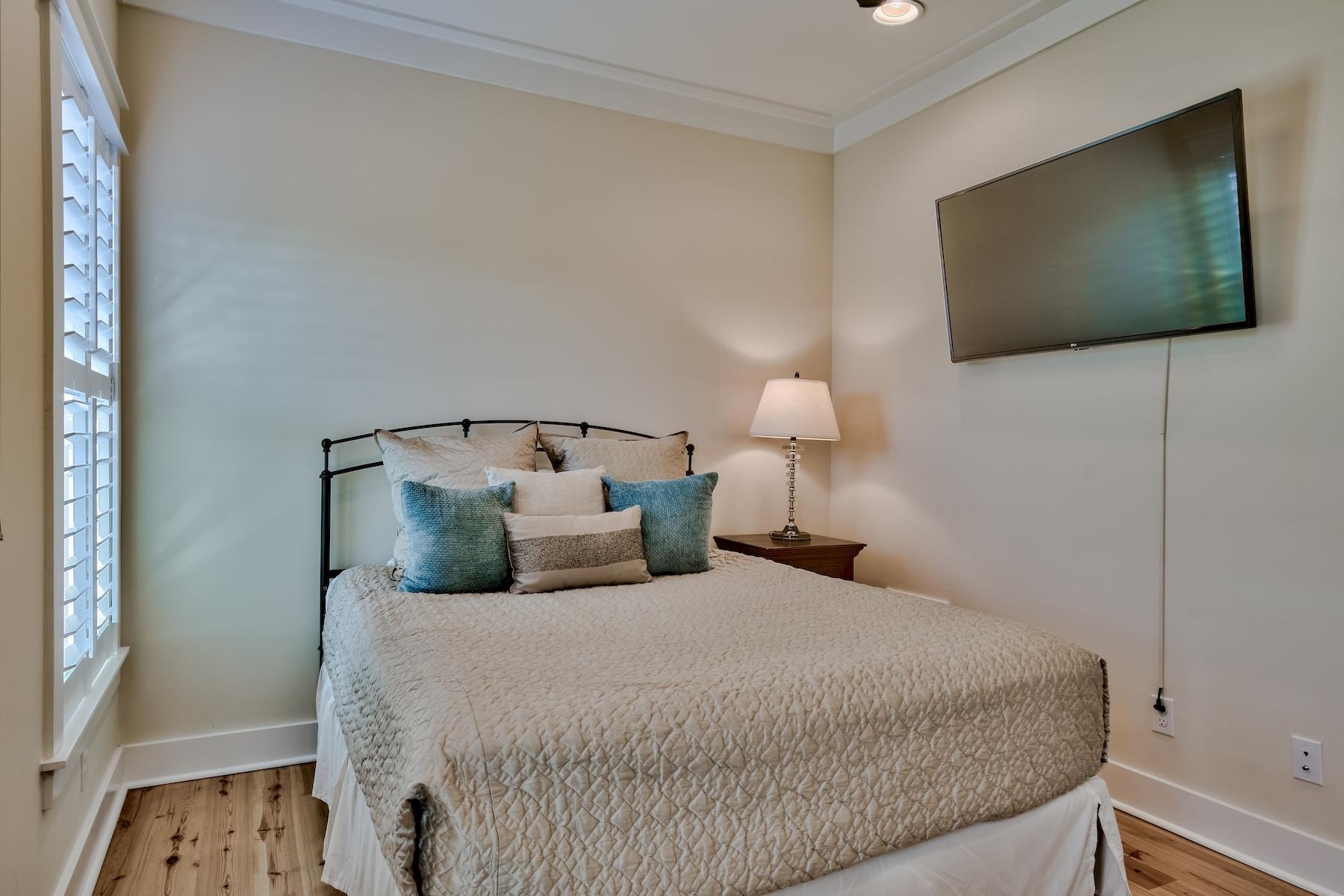 25 South Summit Drive Santa Rosa Beach, FL 32459 - Photo 35 of 46 a bedroom with a bed and a flat screen tv