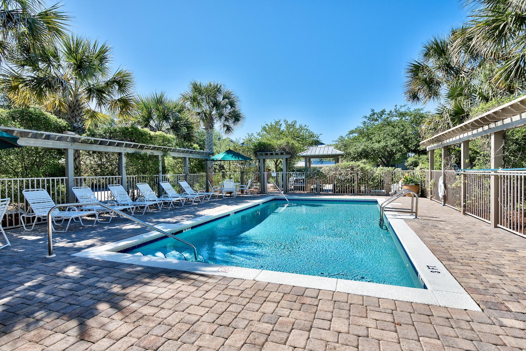 25 South Summit Drive Santa Rosa Beach, FL 32459 - Photo 44 of 46 a view of a swimming pool with chairs