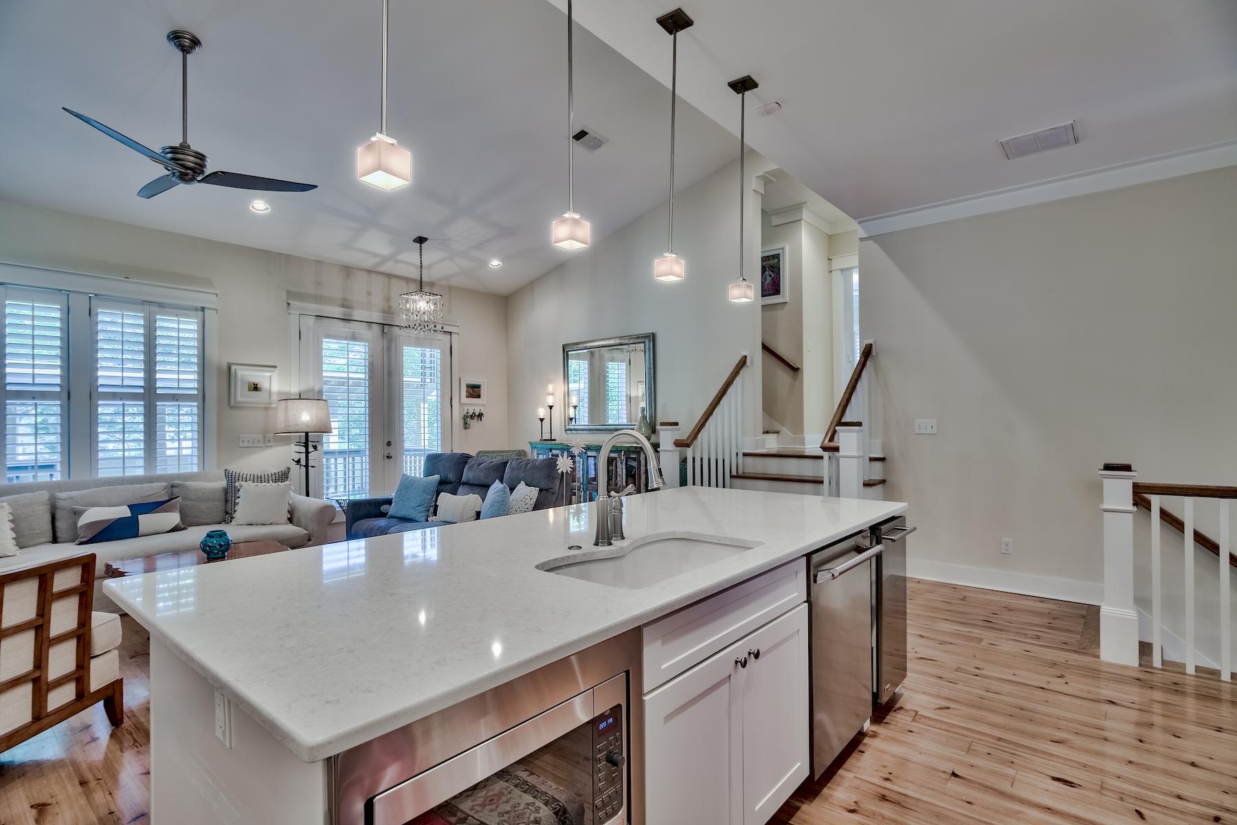 25 South Summit Drive Santa Rosa Beach, FL 32459 - Photo 10 of 46 a view of kitchen island a sink and living room view