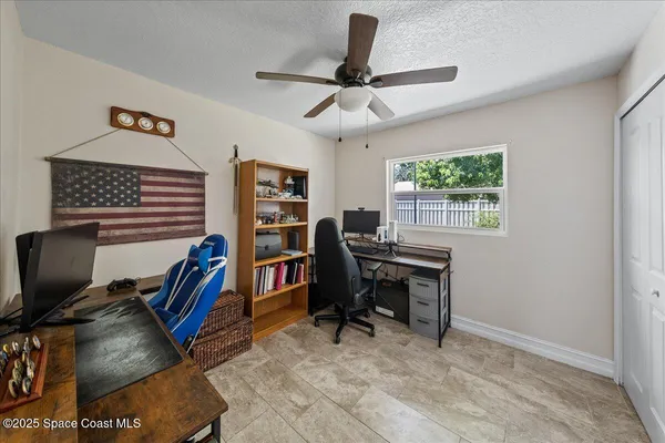 a view of backyard with outdoor seating and green space