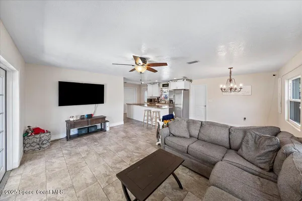 a bedroom with a bed dresser and a window