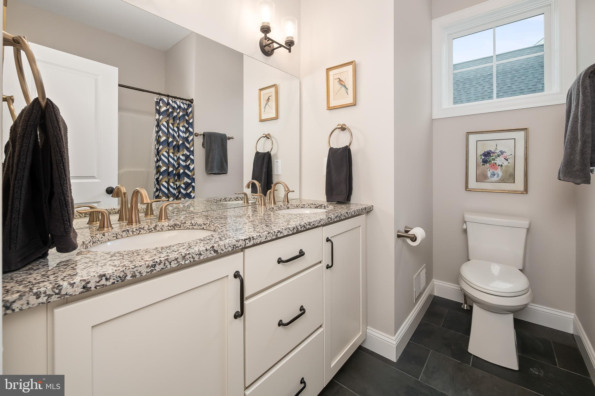 4459 Old Saucon Road Bethlehem, PA 18015 - Photo 27 of 39 a bathroom with a granite countertop sink toilet and shower