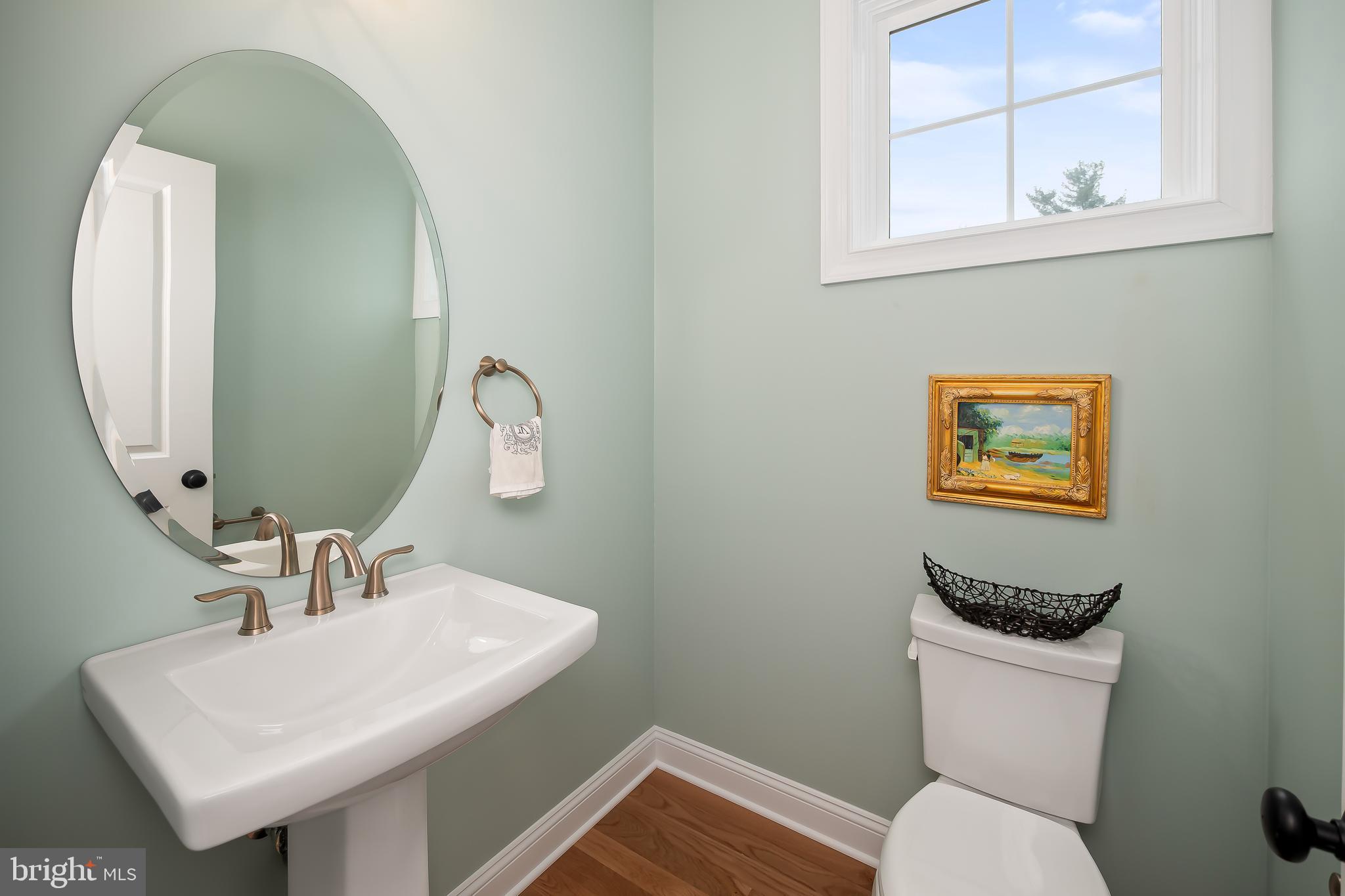 4459 Old Saucon Road Bethlehem, PA 18015 - Photo 31 of 39 a bathroom with a toilet a sink and mirror