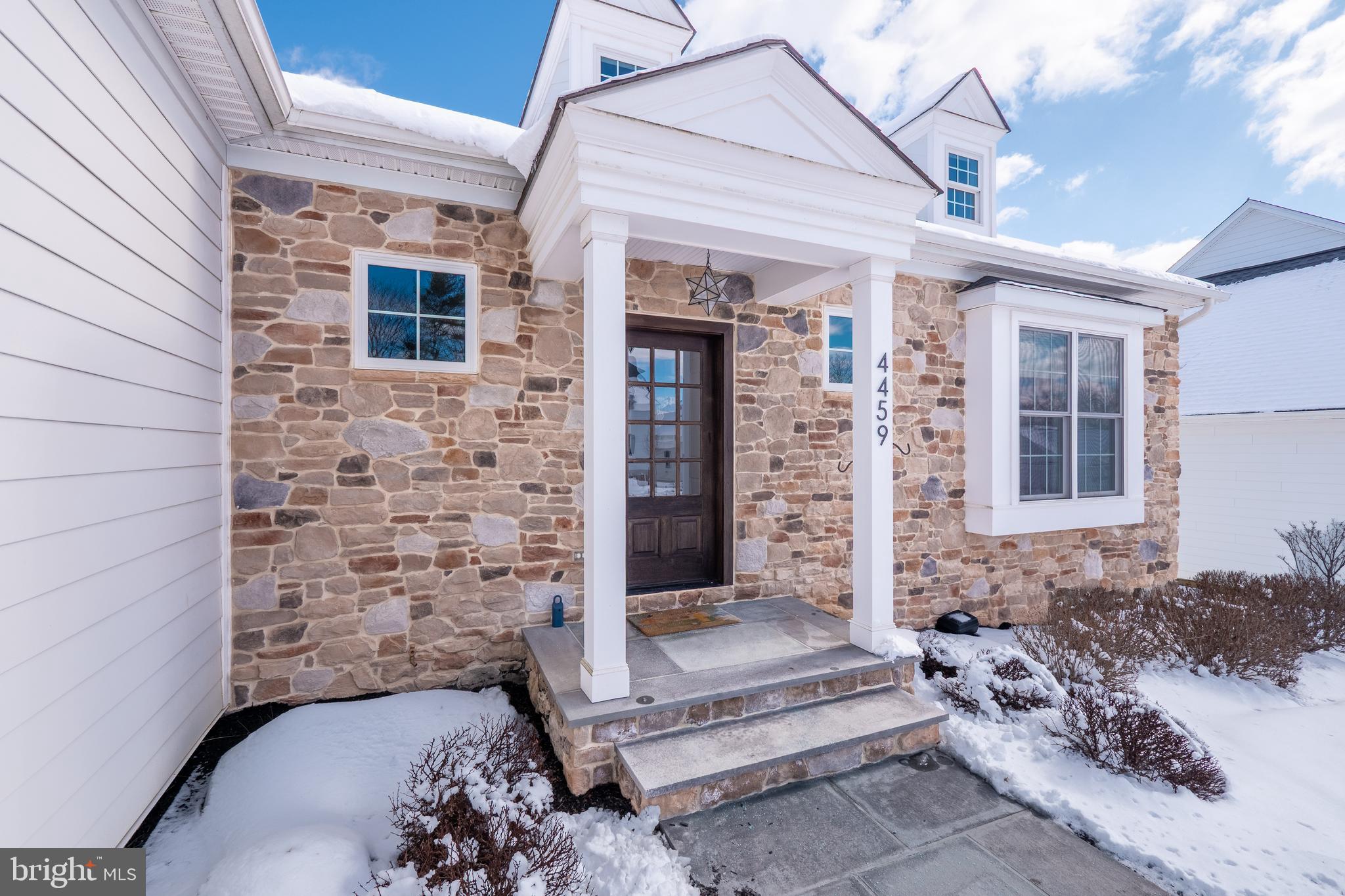 4459 Old Saucon Road Bethlehem, PA 18015 - Photo 5 of 39 a front view of a house with a garden
