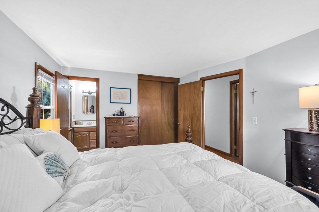 163 Cedar Road Longmeadow, MA 01106 - Photo 16 of 39 a bedroom with a large bed and dresser