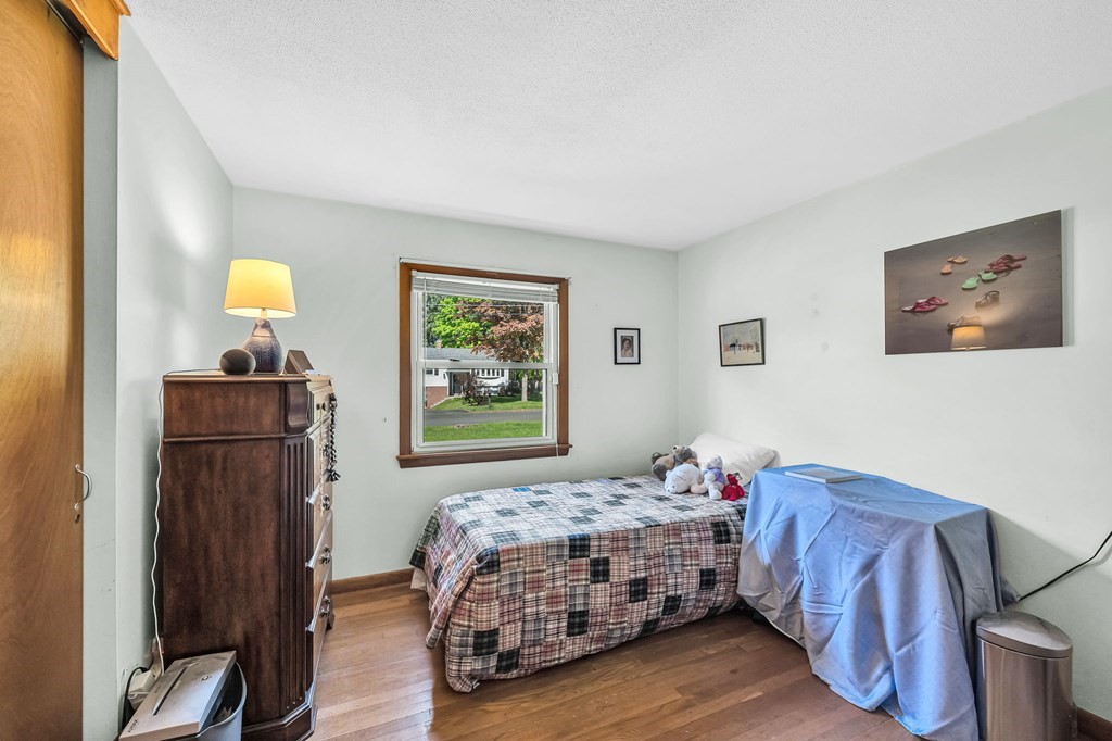163 Cedar Road Longmeadow, MA 01106 - Photo 18 of 39 a bedroom with a bed and a closet