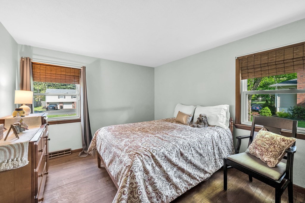 163 Cedar Road Longmeadow, MA 01106 - Photo 20 of 39 a bedroom with a bed and a couch