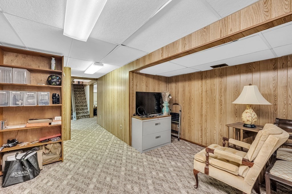163 Cedar Road Longmeadow, MA 01106 - Photo 23 of 39 a living room with furniture and a flat screen tv