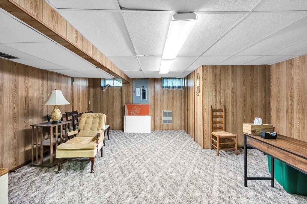 163 Cedar Road Longmeadow, MA 01106 - Photo 24 of 39 a living room with furniture a wooden floor and a table