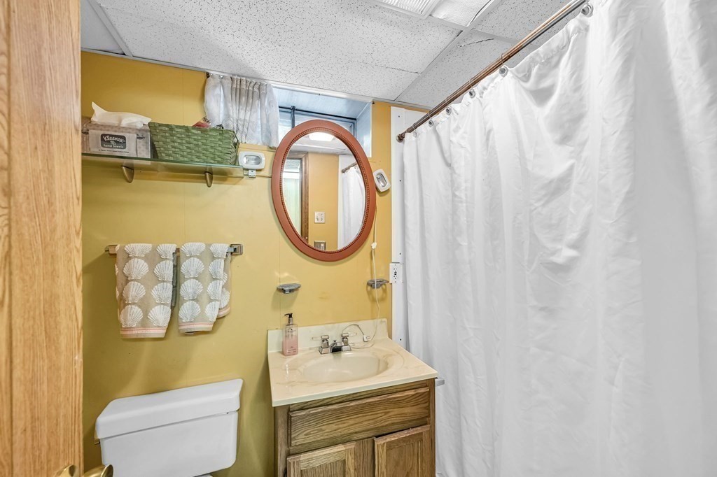 163 Cedar Road Longmeadow, MA 01106 - Photo 28 of 39 a bathroom with a sink and a mirror