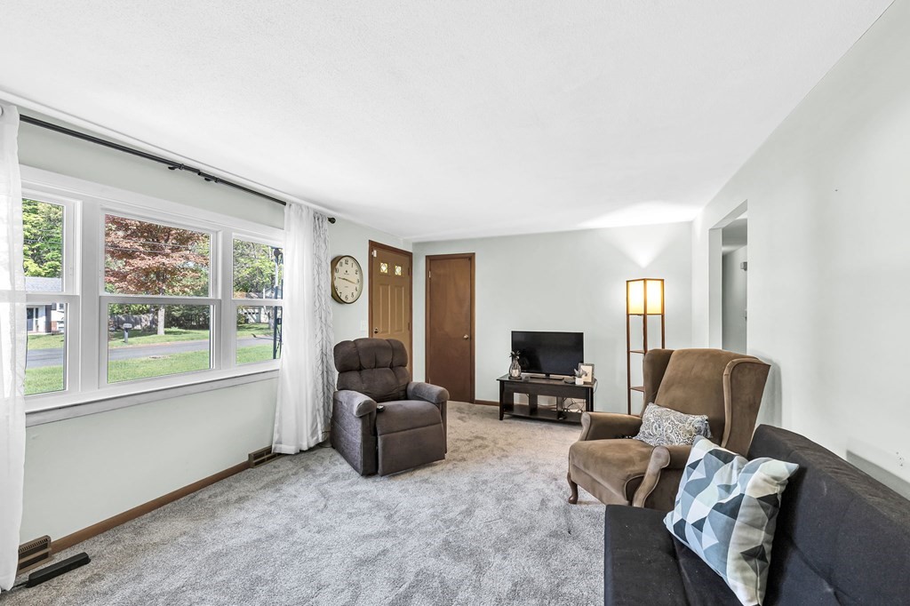 163 Cedar Road Longmeadow, MA 01106 - Photo 3 of 39 a living room with furniture and a flat screen tv