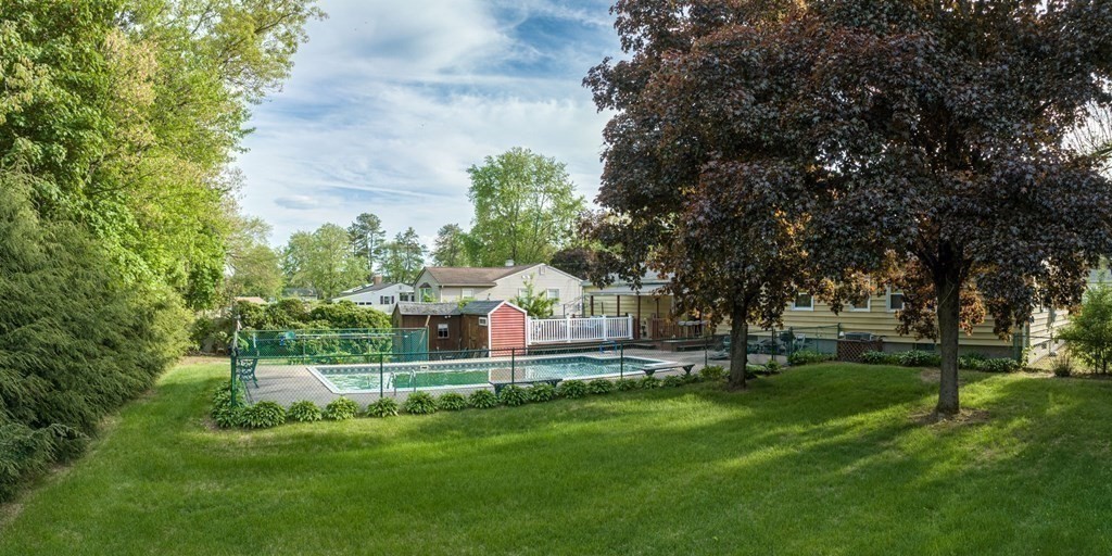 163 Cedar Road Longmeadow, MA 01106 - Photo 36 of 39 a view of a house with a big yard and large trees
