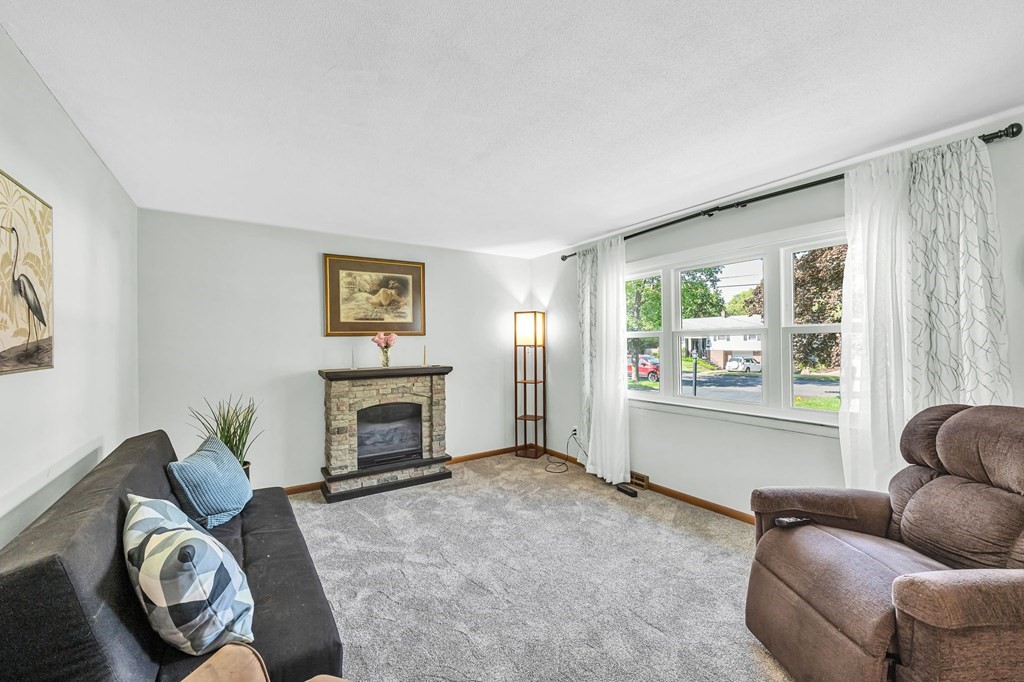 163 Cedar Road Longmeadow, MA 01106 - Photo 4 of 39 a living room with furniture and a fireplace