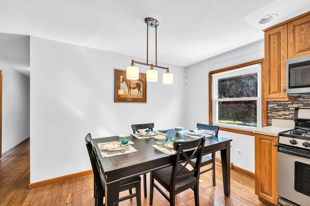 163 Cedar Road Longmeadow, MA 01106 - Photo 6 of 39 a view of a dining room with furniture window and wooden floor