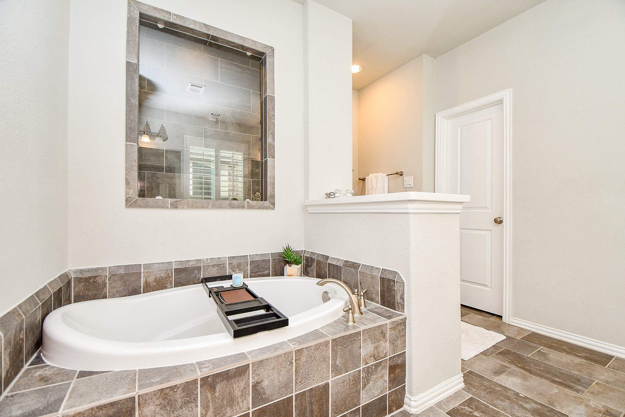 4523 Juniper Ridge Lane Manvel, TX 77578 - Photo 17 of 38 a white bath tub sitting next to a bathroom sink