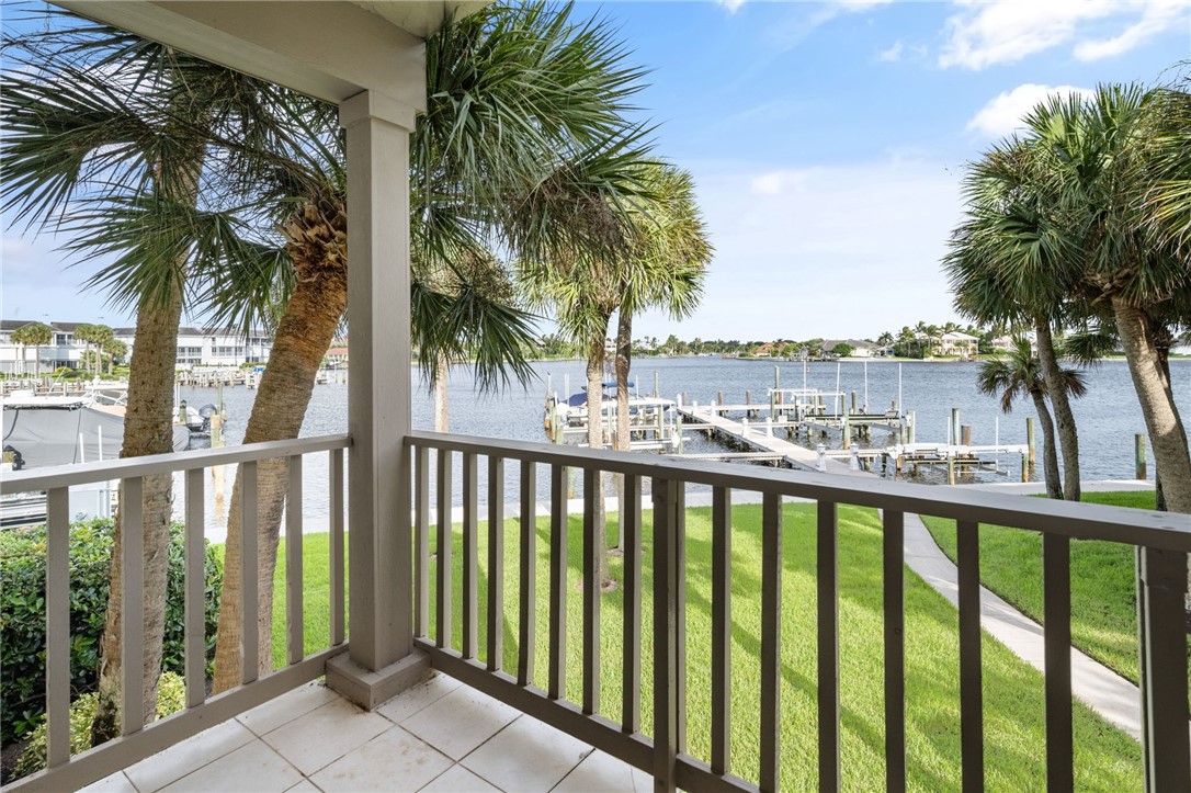 1875 Bay Road, Unit 215H Vero Beach, FL 32963 - Photo 19 of 36 a view of a balcony with a palm tree