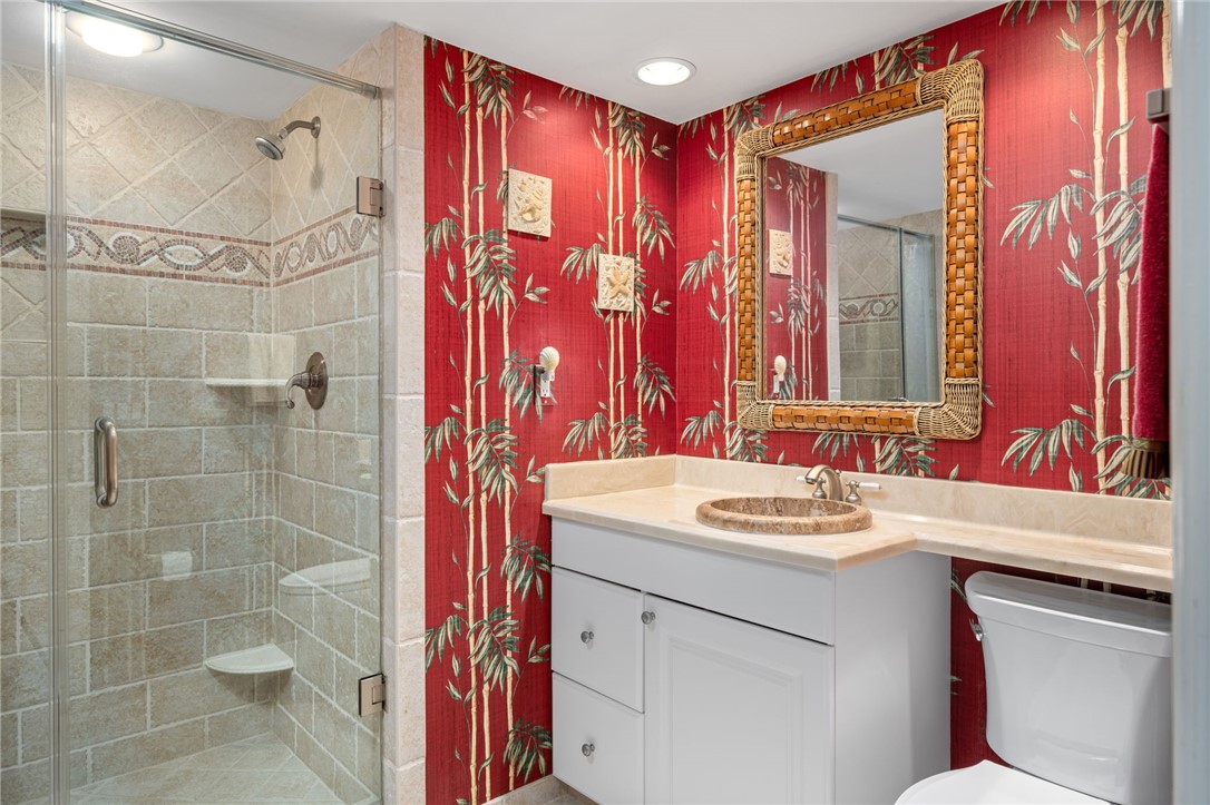 1875 Bay Road, Unit 215H Vero Beach, FL 32963 - Photo 21 of 36 a bathroom with a sink and a mirror