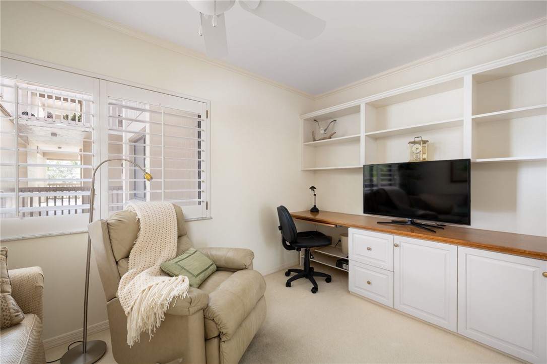 1875 Bay Road, Unit 215H Vero Beach, FL 32963 - Photo 22 of 36 a living room with furniture and a flat screen tv
