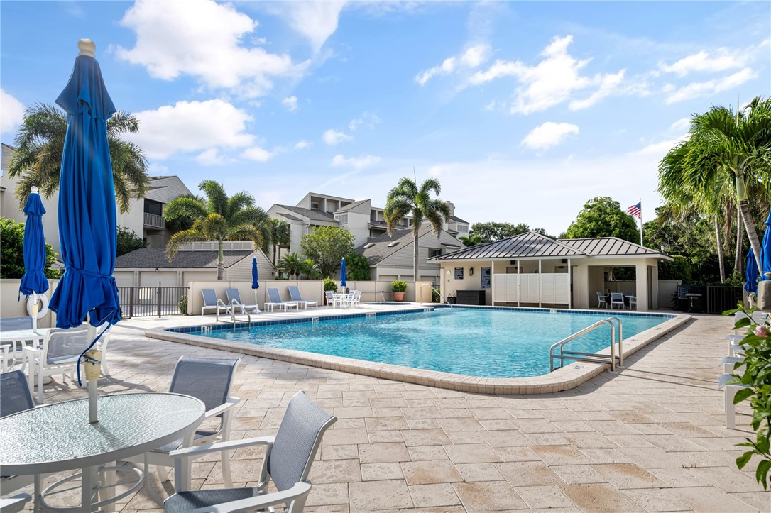 1875 Bay Road, Unit 215H Vero Beach, FL 32963 - Photo 28 of 36 a view of a house with swimming pool and sitting area