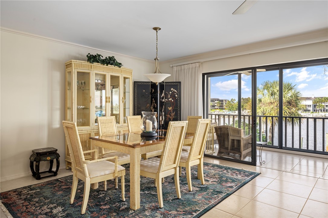 1875 Bay Road, Unit 215H Vero Beach, FL 32963 - Photo 5 of 36 a view of a dining room with furniture window and outside view
