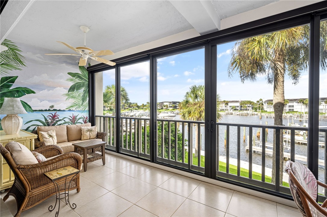 1875 Bay Road, Unit 215H Vero Beach, FL 32963 - Photo 8 of 36 a balcony with furniture and city view
