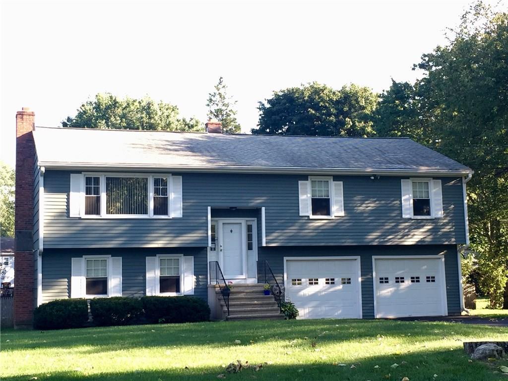 36 Zephyr Road Trumbull, CT 06611 - Photo 1 of 1 a front view of a house with garden