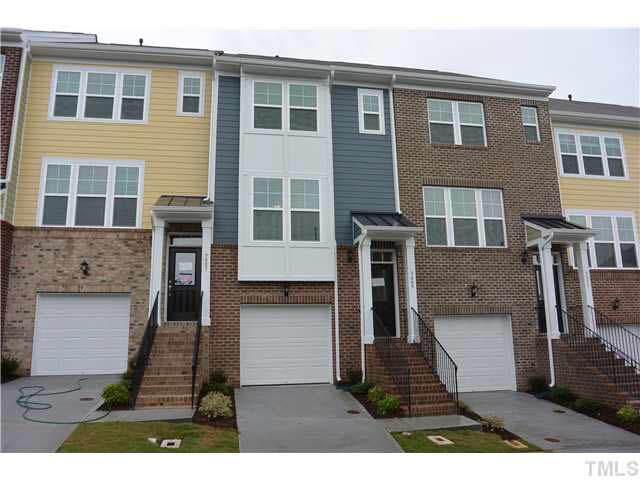5009 Lalex Lane Cary, NC 27519 - Photo 1 of 15 a view of a house with wooden door and outdoor space