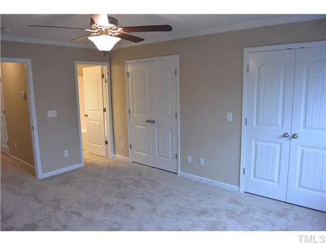 a view of an empty room with a chandelier