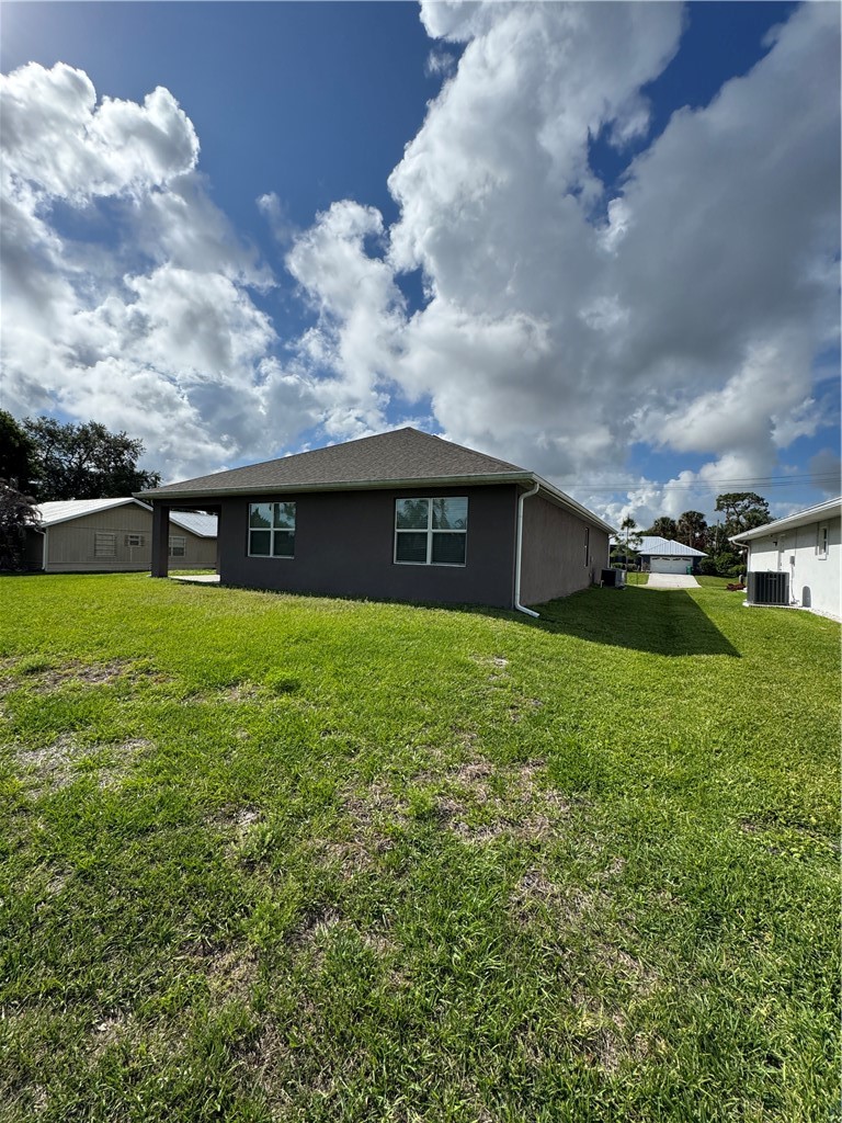 1836 Barber Street Sebastian, FL 32958 - Photo 6 of 29 a view of a house with a back yard