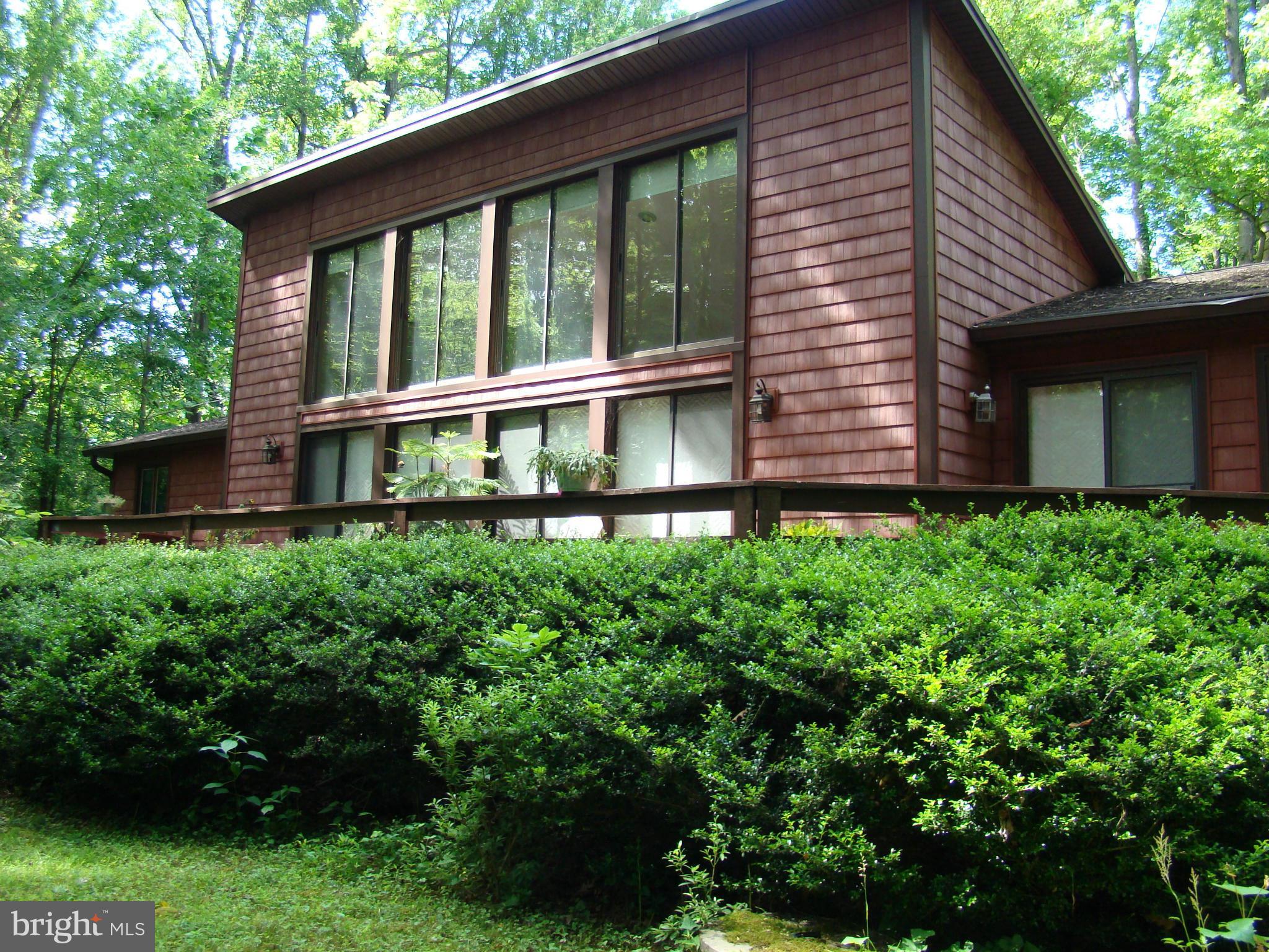 3100 Ross Road St. Leonard, MD 20685 - Photo 1 of 23 a house with a tree in the background
