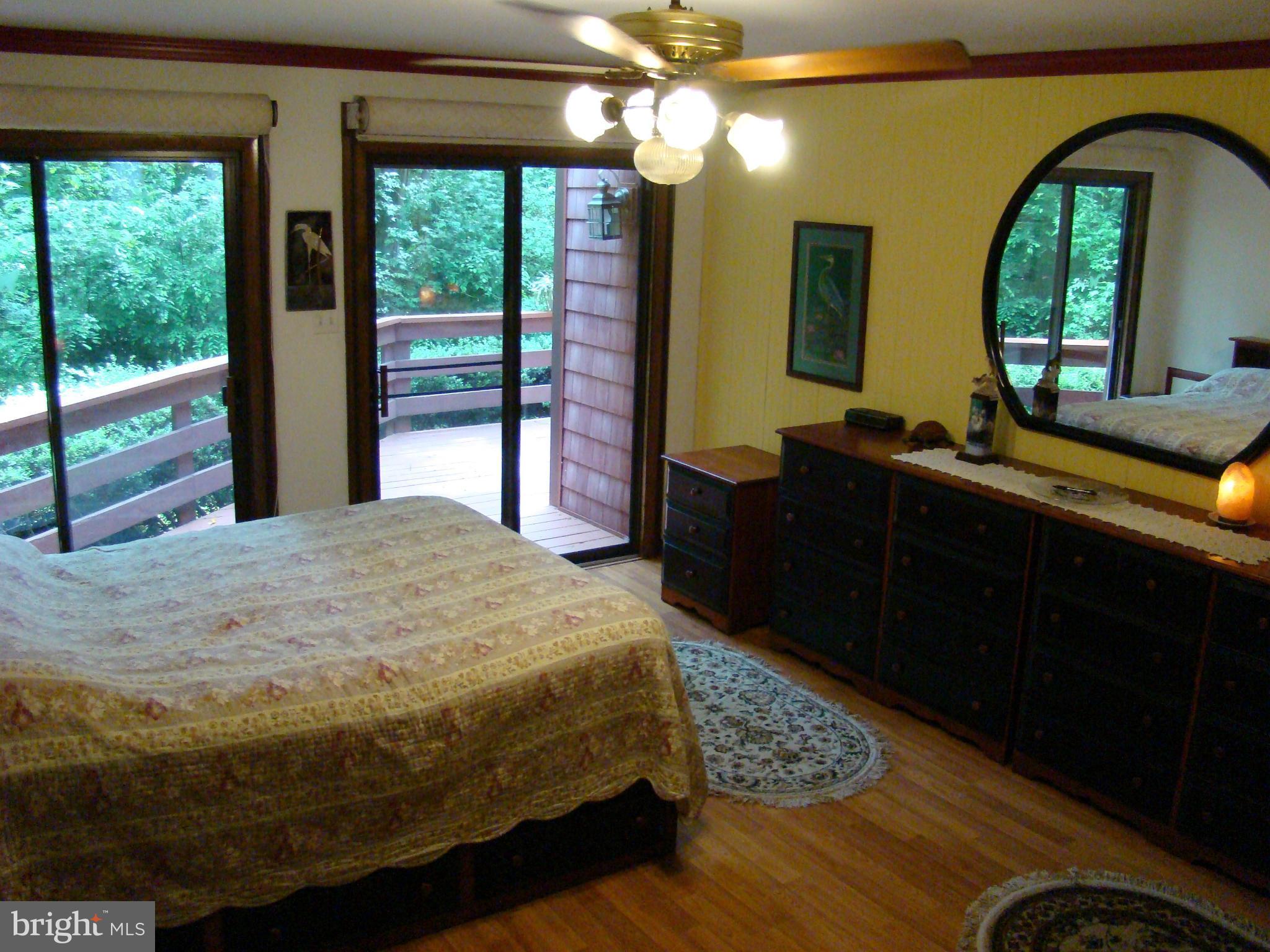 3100 Ross Road St. Leonard, MD 20685 - Photo 11 of 23 a bedroom with a bed and wooden floor