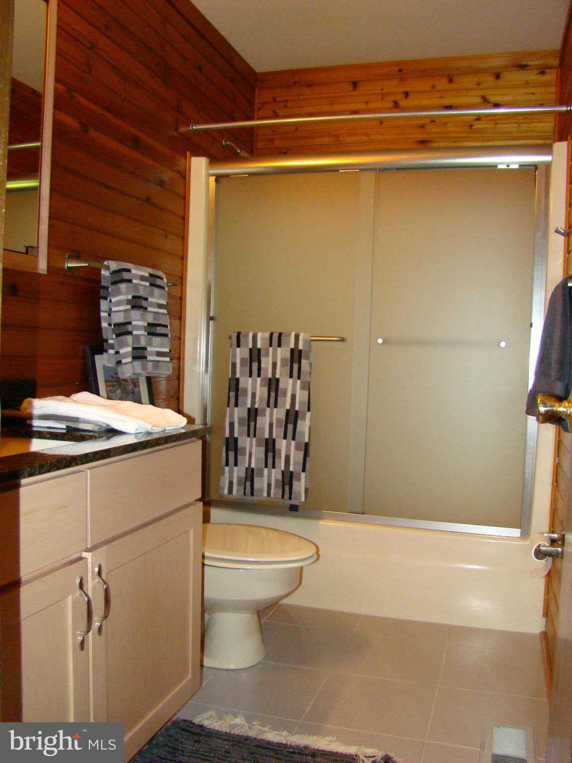 3100 Ross Road St. Leonard, MD 20685 - Photo 18 of 23 a bathroom with a toilet and shower