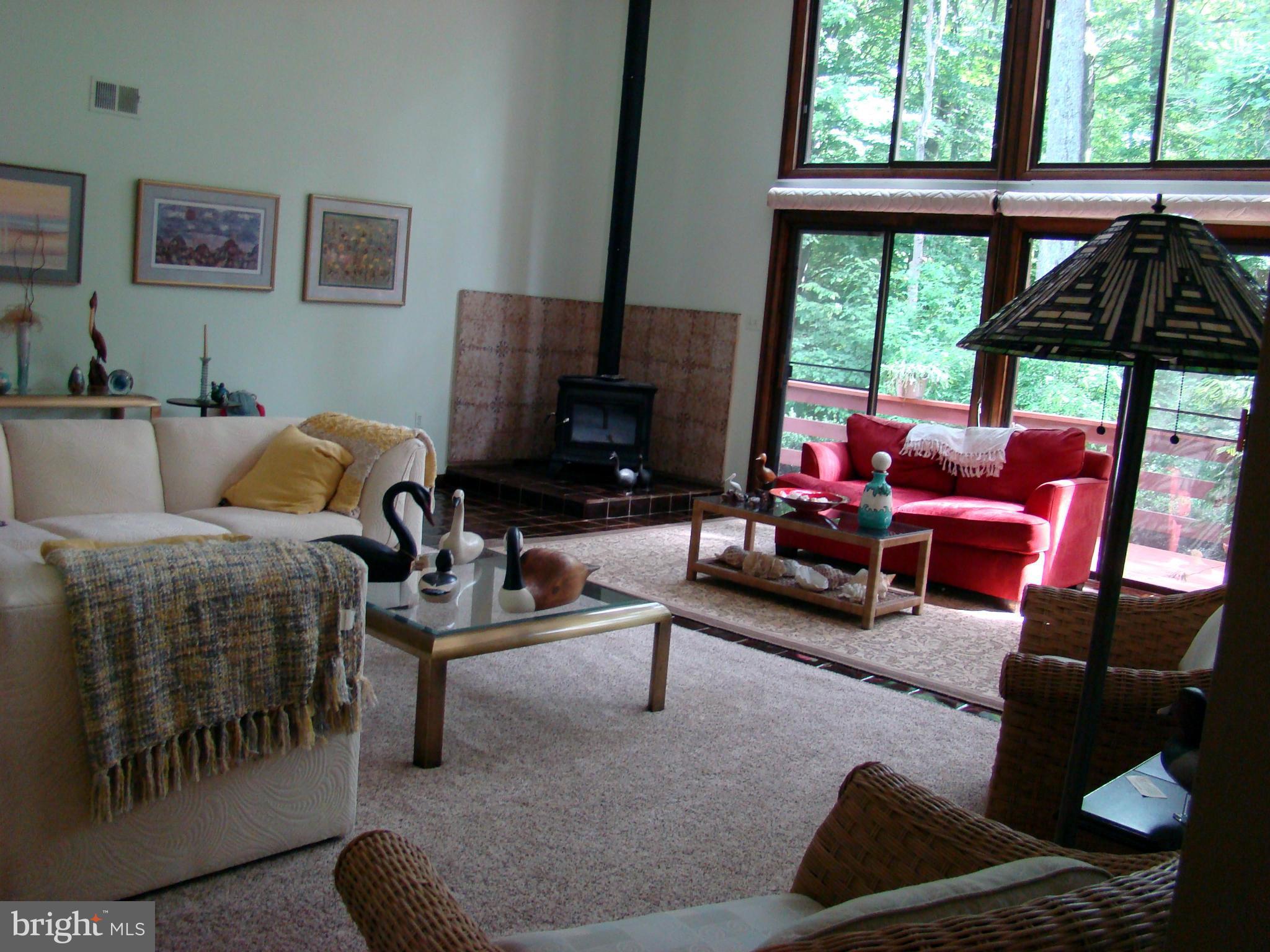3100 Ross Road St. Leonard, MD 20685 - Photo 6 of 23 a living room with furniture and a floor to ceiling window