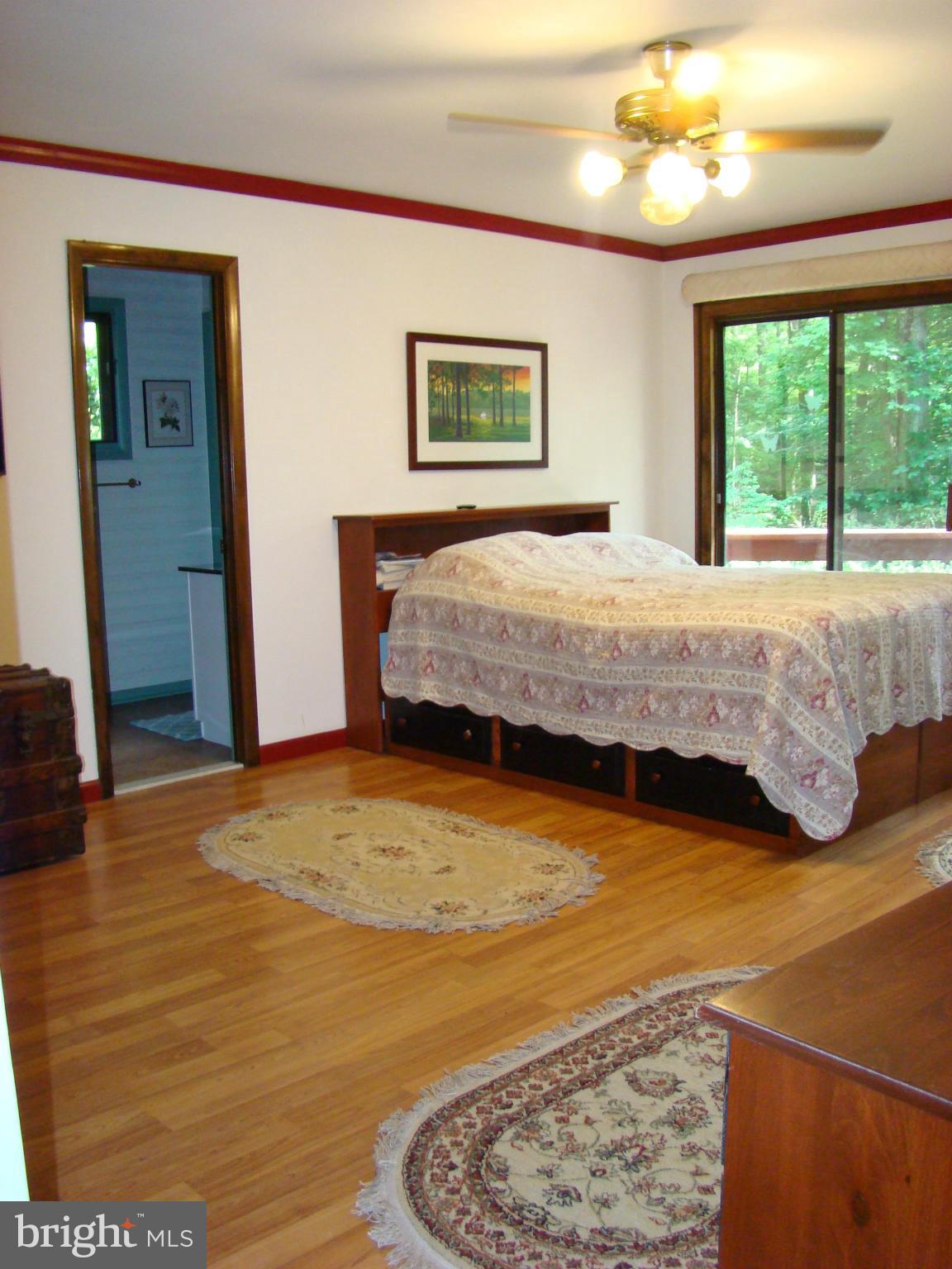 3100 Ross Road St. Leonard, MD 20685 - Photo 10 of 23 a bedroom with a bed and a large window