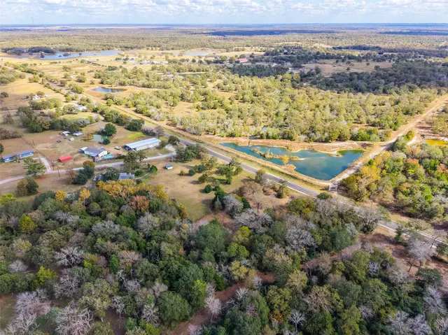 a view of ocean and green space